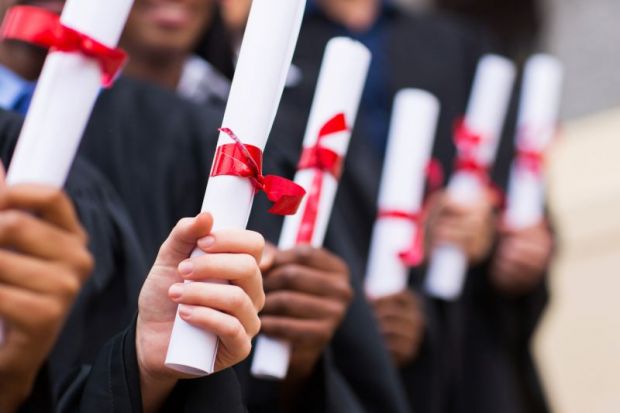 group_of_graduates_holding_degree_certificates.jpg