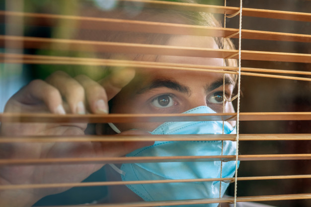 sick-man-corona-virus-looking-through-window-wearing-mask-protection-recovery-from-illness-home-quarantine_120960-1710.jpg