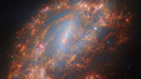 NASA’s Hubble Spots Blinding Explosion in Distant Spiral Galaxy
