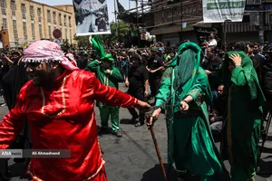 آیین خیمه سوزان عاشورا در چهارراه گلوبندک تهران
