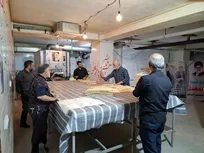 از اربعین تا خط مقدم؛ روزی ۲۱ هزار قرص نان صلواتی به دست رزمندگان می‌رسد+ عکس و فیلم