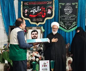 تکریم خانواده شهید علی خدادادی 