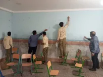 نقاشی خدمت بر دیوار مدارس با اردوی جهادی دانشجویان